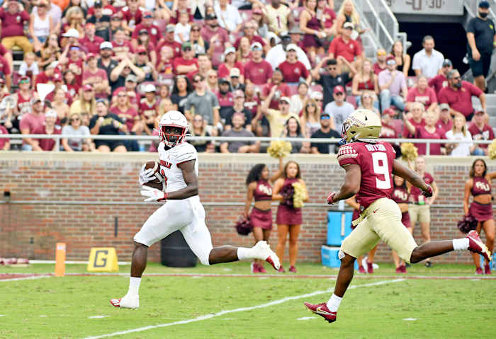 Louisville Cardinals wide receiver Tyler Harrell (8) scores a touchdown during the first quarter at Doak S. Campbell Stadium.